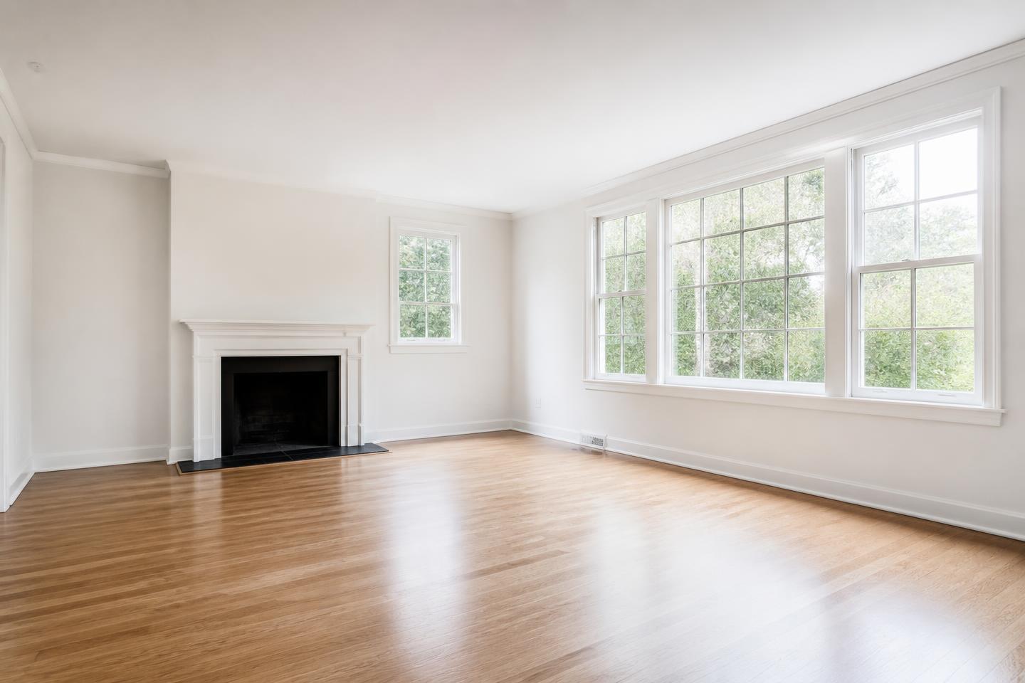 Living room after professional repainting, flawless warm white walls